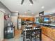 Bright kitchen with stainless steel appliances, a large center island, and a breakfast bar at 15203 N 153Rd Dr, Surprise, AZ 85379