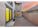 The backyard features gravel landscaping, a small patio and access doors to the home at 15469 W Dreyfus St, Surprise, AZ 85379