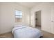 Cozy bedroom with carpet, natural light, and closet at 15469 W Dreyfus St, Surprise, AZ 85379