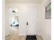 Entryway features neutral walls and flooring with views into a living area at 15469 W Dreyfus St, Surprise, AZ 85379