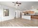 Bright and airy living space features neutral walls, wood floors and many doorways at 15469 W Dreyfus St, Surprise, AZ 85379