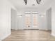 Inviting living room featuring wood-look floors and bright lighting at 15469 W Dreyfus St, Surprise, AZ 85379