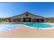Community pool and splash pad featuring a large building for events and gatherings at 15469 W Dreyfus St, Surprise, AZ 85379