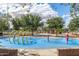 Interactive splash pad features colorful water features and adjacent seating areas at 15469 W Dreyfus St, Surprise, AZ 85379