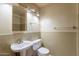 Small bathroom including toilet, sink, vanity, and lighting at 1654 E 2Nd St, Mesa, AZ 85203