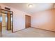Bedroom with a view into the next room and a closet for storage at 1654 E 2Nd St, Mesa, AZ 85203