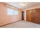 Bedroom featuring natural light, wall to wall carpet, and closet at 1654 E 2Nd St, Mesa, AZ 85203