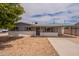 Charming single-story house boasts low-maintenance landscaping and a welcoming covered parking area at 1654 E 2Nd St, Mesa, AZ 85203