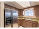 Efficient kitchen layout features stainless steel refrigerator and a window overlooking the sink at 1654 E 2Nd St, Mesa, AZ 85203