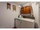 Laundry room area featuring a washer, dryer, and vintage decor at 1654 E 2Nd St, Mesa, AZ 85203