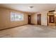 Bright living room with large window offers natural light and plush carpet at 1654 E 2Nd St, Mesa, AZ 85203