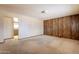 An empty living room features paneled wall and neutral colors at 1654 E 2Nd St, Mesa, AZ 85203