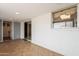 The sunroom has tile floors, a large window and sliding glass door to the exterior at 1654 E 2Nd St, Mesa, AZ 85203