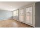 Bright sunroom featuring tile floors, natural light from windows and a set of French doors at 1654 E 2Nd St, Mesa, AZ 85203