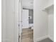 Hallway view of a bathroom with a white toilet, shower, and subway tile at 1717 E Union Hills Dr # 1033, Phoenix, AZ 85024