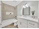 Bright bathroom with a shower-over-tub, white vanity and modern mirror at 1717 E Union Hills Dr # 1033, Phoenix, AZ 85024