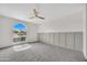 Bedroom with large window, ceiling fan, and carpeted floor at 1717 E Union Hills Dr # 1033, Phoenix, AZ 85024