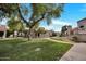 Well-maintained grounds feature grassy areas, mature trees, and walking paths at 1717 E Union Hills Dr # 1033, Phoenix, AZ 85024