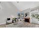Cozy living room with tall windows, stylish seating, wood floors, and a fireplace, creating an inviting and comfortable space at 1717 E Union Hills Dr # 1033, Phoenix, AZ 85024