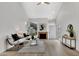 Comfortable living room featuring wood floors, a fireplace, and bright windows, seamlessly blending style and relaxation at 1717 E Union Hills Dr # 1033, Phoenix, AZ 85024
