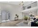 Spacious open-concept living area with wood floors, leading to a modern kitchen and featuring a sliding door to the outside at 1717 E Union Hills Dr # 1033, Phoenix, AZ 85024