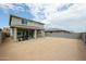 Exterior view of backyard with a covered patio and grill area at 18813 W Solano Dr, Litchfield Park, AZ 85340
