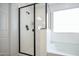 Clean, modern bathroom featuring a glass-enclosed shower and a separate tub at 18813 W Solano Dr, Litchfield Park, AZ 85340