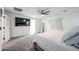 Bedroom with a ceiling fan, carpeted floors, and lots of natural light at 18813 W Solano Dr, Litchfield Park, AZ 85340