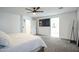Bedroom with a ceiling fan, carpeted floors and access to the bathroom at 18813 W Solano Dr, Litchfield Park, AZ 85340