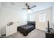 Bedroom with a ceiling fan, TV, and a three-drawer dresser at 18813 W Solano Dr, Litchfield Park, AZ 85340