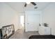 Simple bedroom with carpet, ceiling fan, dresser and decorations at 18813 W Solano Dr, Litchfield Park, AZ 85340