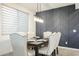 Dining room with wainscotting and a modern light fixture at 18813 W Solano Dr, Litchfield Park, AZ 85340