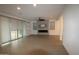 Open living room with tile flooring, modern fireplace, and lots of natural light at 18813 W Solano Dr, Litchfield Park, AZ 85340