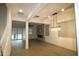 Bright living room boasts wood-look tile floors and a modern fireplace at 18813 W Solano Dr, Litchfield Park, AZ 85340