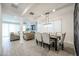 Open-concept living room and dining area with modern finishes and plenty of natural light at 18813 W Solano Dr, Litchfield Park, AZ 85340