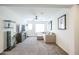 A cozy living room featuring a plush sofa, TV over fireplace, and ample natural light at 18813 W Solano Dr, Litchfield Park, AZ 85340