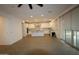 Open living space with a kitchen, dining, and living area with tile flooring at 18813 W Solano Dr, Litchfield Park, AZ 85340