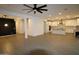 Bright open living space featuring tile floors, living area, kitchen, and stairs at 18813 W Solano Dr, Litchfield Park, AZ 85340