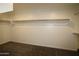 Spacious walk-in closet with ample storage and shelving perfect for organizing your wardrobe at 18813 W Solano Dr, Litchfield Park, AZ 85340