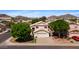 Charming home with a well-manicured front yard and inviting entrance, nestled in a picturesque neighborhood at 20404 N 28Th Pl, Phoenix, AZ 85050