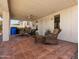Covered back patio with seating and a ceiling fan overlooking the neighborhood at 20404 N 28Th Pl, Phoenix, AZ 85050