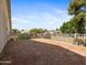 A view from a covered back porch overlooking neighboring houses and community landscaping at 20404 N 28Th Pl, Phoenix, AZ 85050