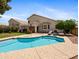 Private backyard features a refreshing swimming pool, lush greenery, and ample space for outdoor relaxation at 20404 N 28Th Pl, Phoenix, AZ 85050