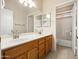 Bright bathroom with double sinks and a large mirror, in a home for sale at 20404 N 28Th Pl, Phoenix, AZ 85050