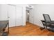 Bedroom with hardwood floors and a closet, providing a simple and functional space at 20404 N 28Th Pl, Phoenix, AZ 85050