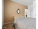 Bedroom featuring a dresser and mirror with view through doorway to another room at 20404 N 28Th Pl, Phoenix, AZ 85050