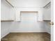 Large walk-in closet with custom shelving and plenty of storage space at 20404 N 28Th Pl, Phoenix, AZ 85050