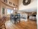 Dining area with modern table and chairs, featuring bright light and hardwood flooring at 20404 N 28Th Pl, Phoenix, AZ 85050