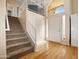 Inviting entryway with hardwood floors, a staircase, and a view of the upper level at 20404 N 28Th Pl, Phoenix, AZ 85050
