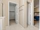 Hallway with closet and view to bedroom with bed and blue comforter at 20404 N 28Th Pl, Phoenix, AZ 85050